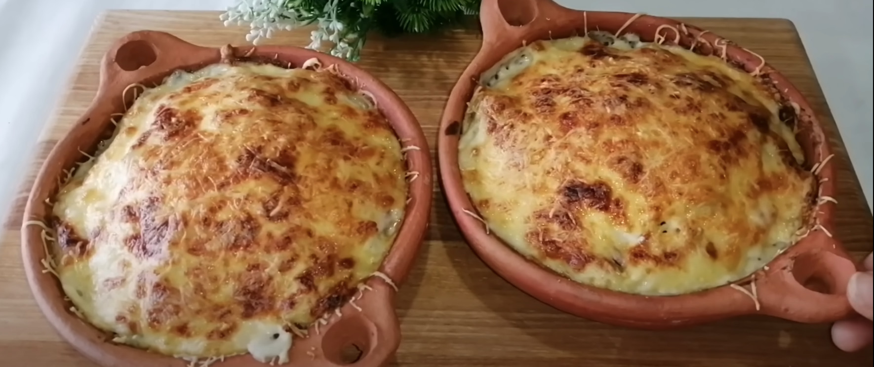 Two bowls of food on a table.