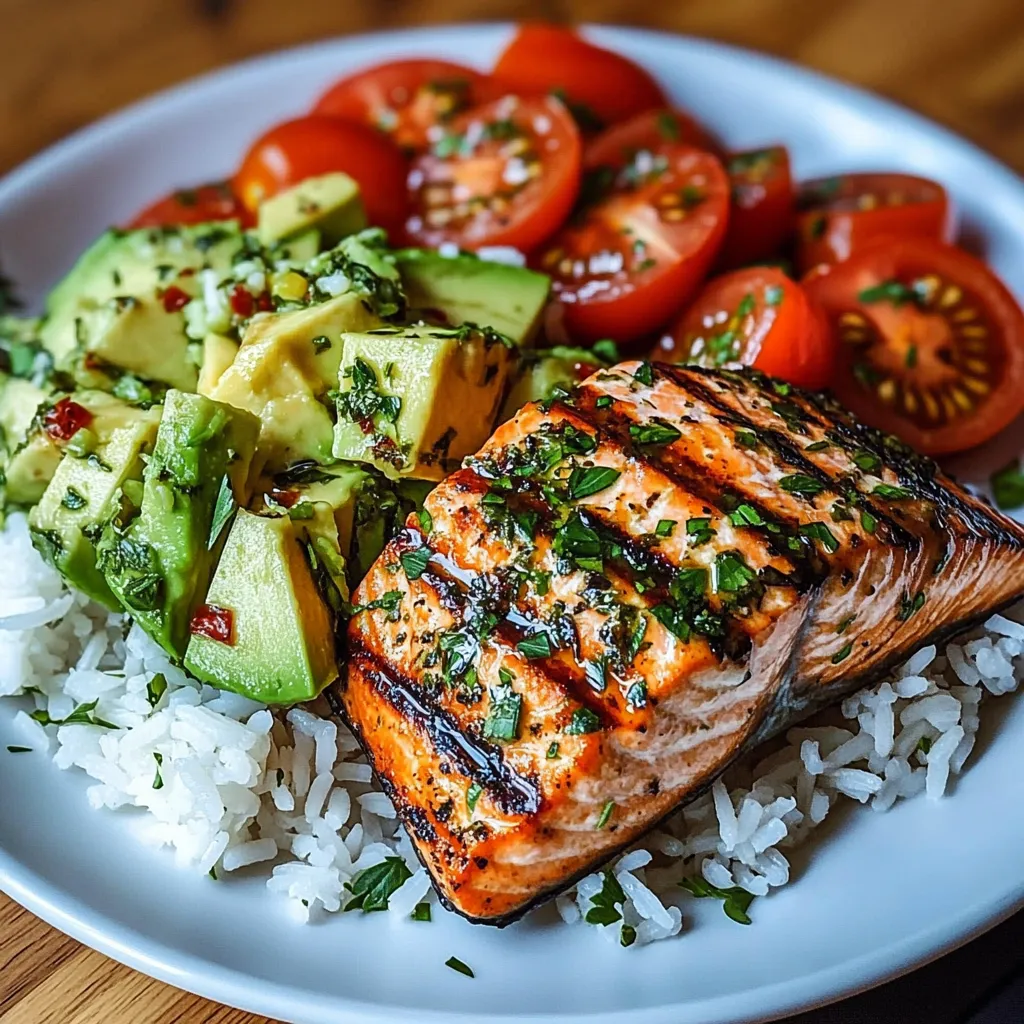 A plate of food with fish, rice, and tomatoes.