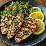 A plate of chicken and vegetables.