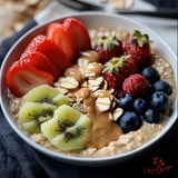 A bowl of granola with fruit.