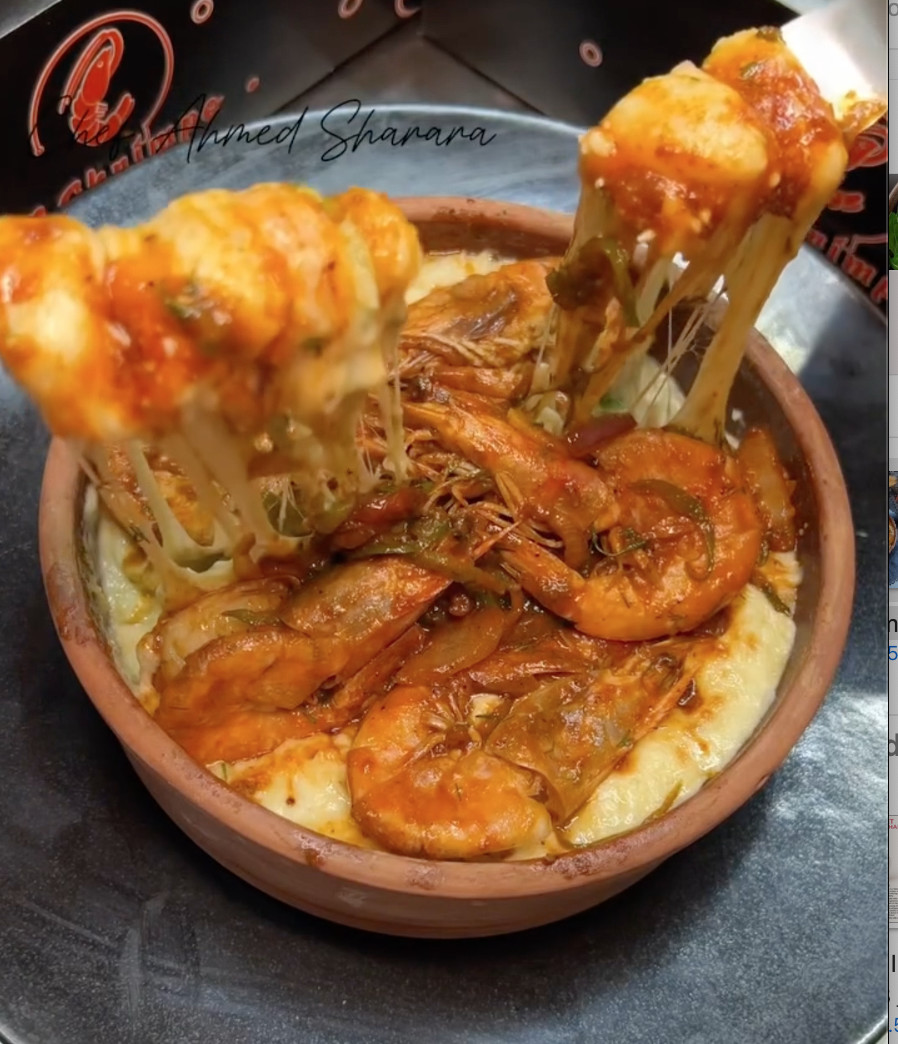 A bowl of shrimp and cheese.
