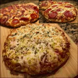 Two pizzas on a table.