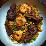 A bowl of shrimp and rice.