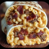 A burrito with macaroni and bacon.