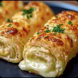 Two pieces of cheese and herb stuffed bread.