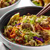 A bowl of meat and vegetables.